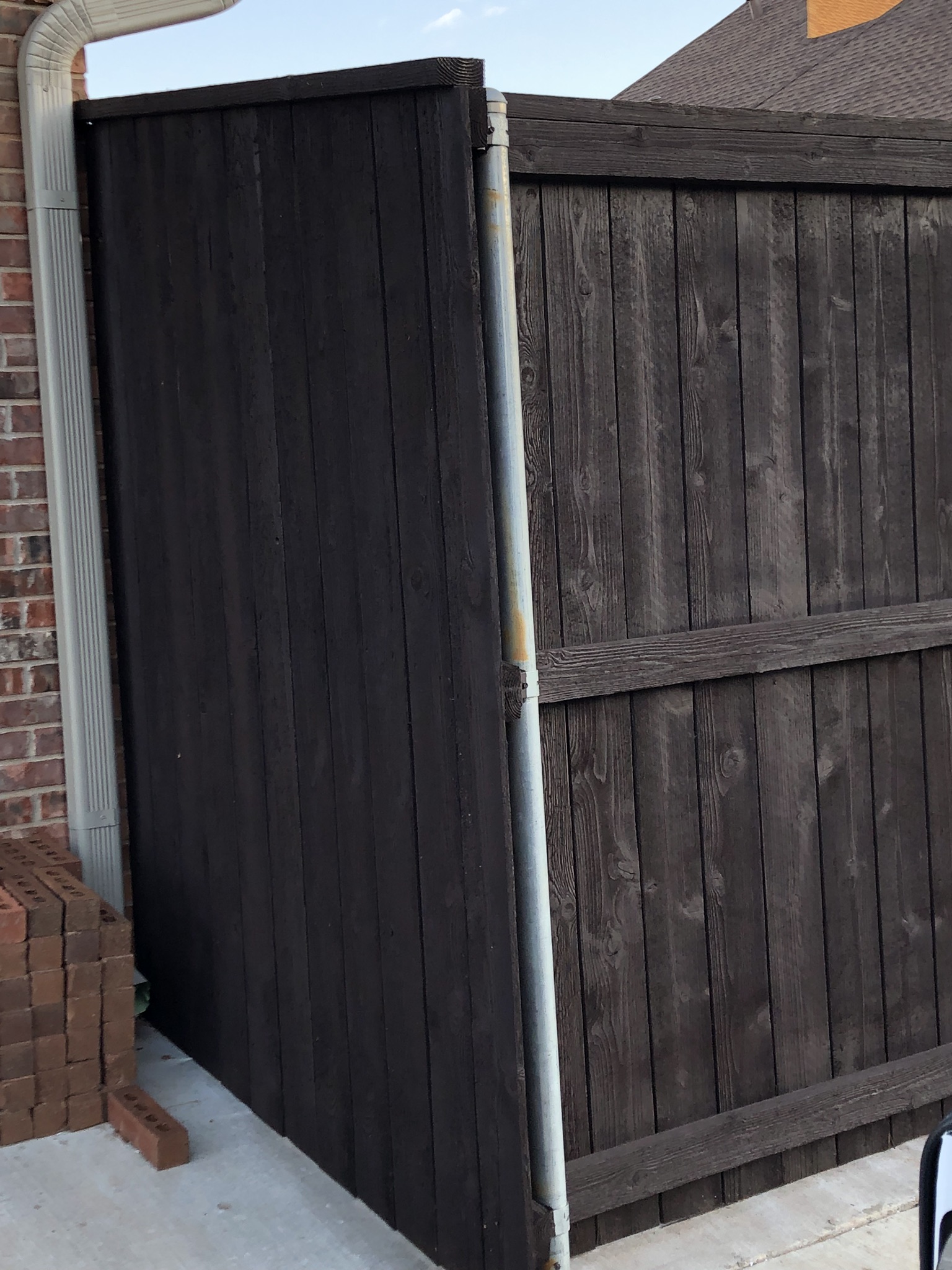 New wood privacy fence installed along a residential property line