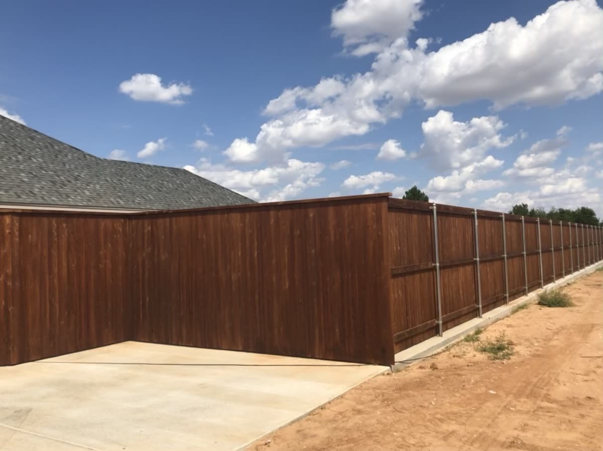 Wood fence with matching gate and clean trim details