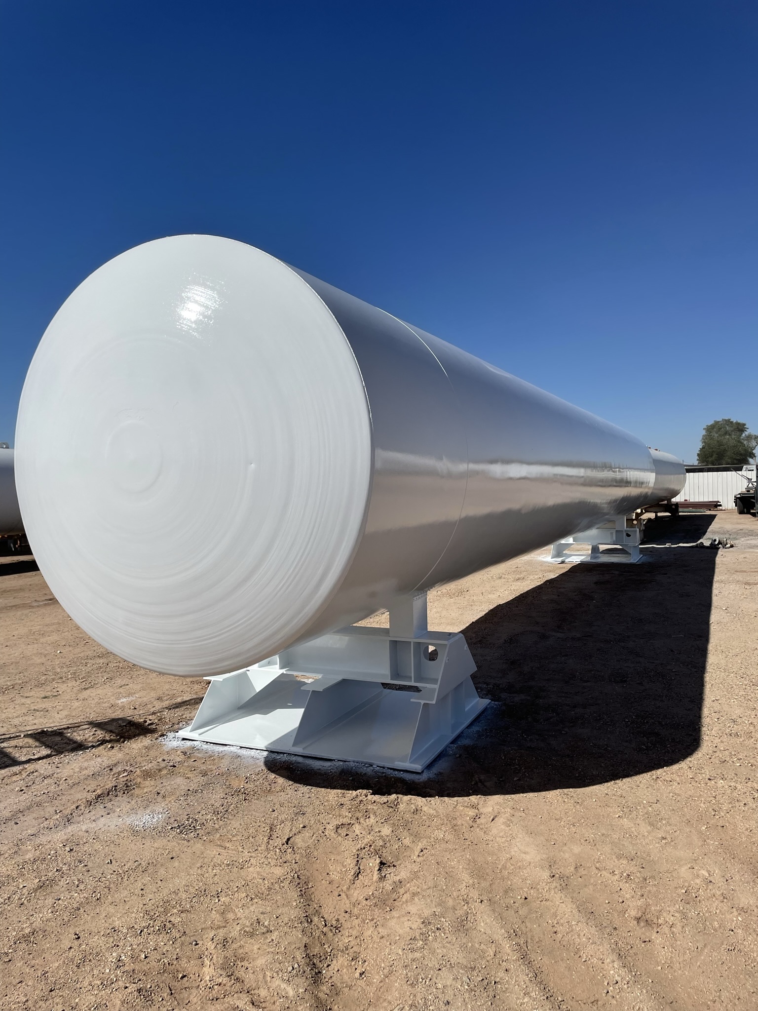 Large industrial tank freshly coated in white protective paint