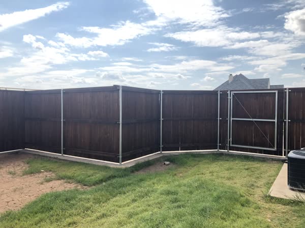Privacy fence stained with a medium brown tone