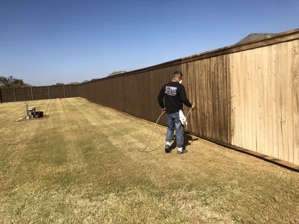 Fence staining in progress