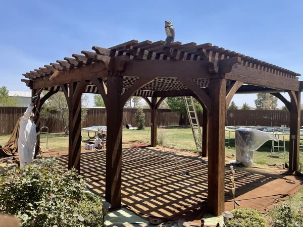 Pergola with stained wood finish